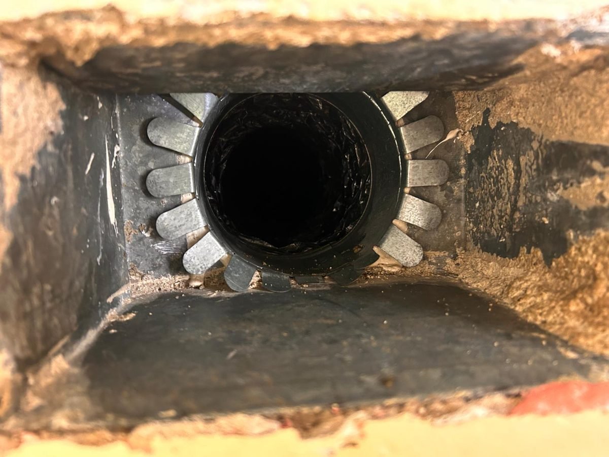 Vent boot after repair with new collar connecting to the duct